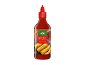 Steklenica sladke sriracha omake s sliko pomladnih zavitkov.