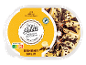 Bananin sladoled s čokoladno omako in čokoladnimi ostružki, z oznako Rainforest Alliance.