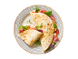 Piadina s pršutom, mocarelo, paradižnikom, bučkami in rukolo na črtastem krožniku.