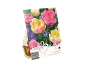 Embalaža za čebulice tulipanov z rožnatimi in rumenimi tulipani, označena „Lovely Combinations“.