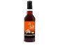 Kavni sirup z okusom karamele v temni steklenici z oranžno etiketo in karamelnimi kockami.