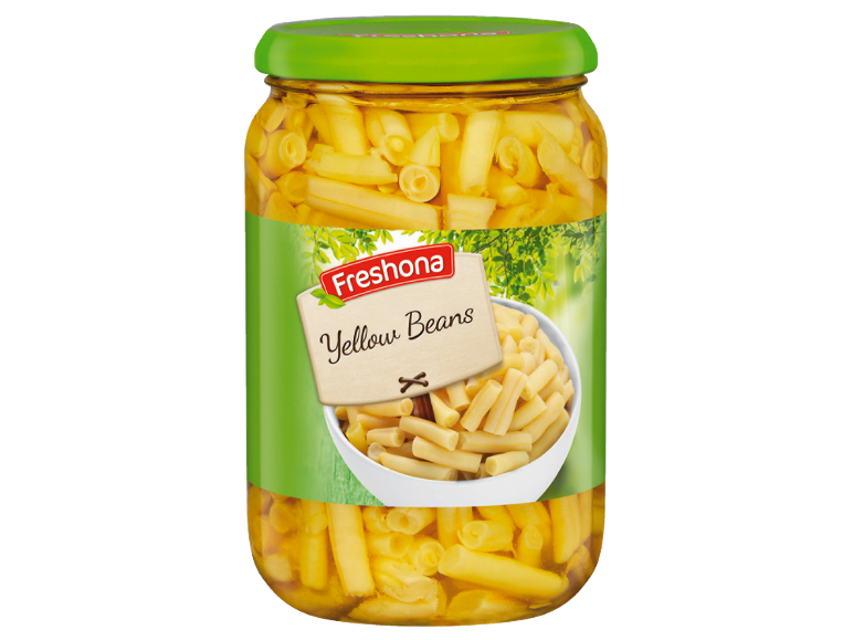 Kozarec rumenega fižola z etiketo »Yellow Beans« in skledo fižola.
