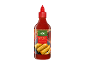 Steklenica sladke sriracha omake s sliko pomladnih zavitkov.
