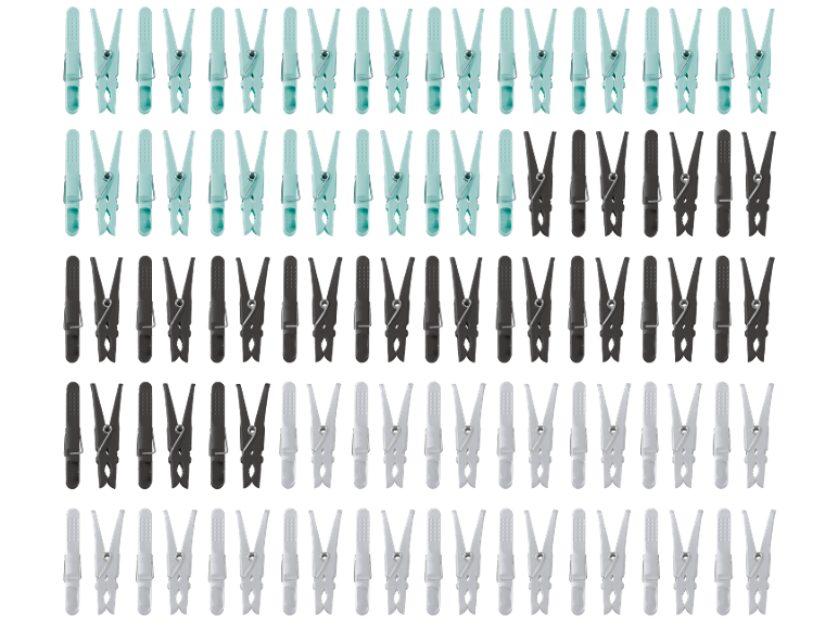 Vrste svetlo modrih, temno sivih in belih ščipalk za perilo na črnem ozadju.