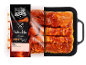 Marinirano meso s slanino v embalaži, z etiketo 'Nabodala s slanino' in neto težo 460g.