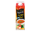 Karton zelenjavne gazpacho juhe, postrežene hladne, z skledo juhe in svežimi sestavinami.