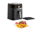 Tefal Easy Fry & Grill cvrtnik na vroč zrak s pomfritom in zrezkom.