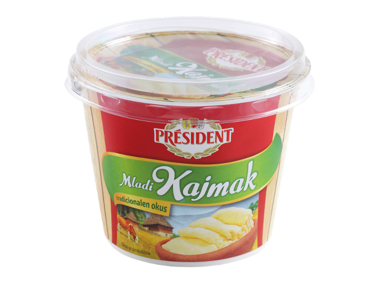 Posoda mladega kajmaka s tradicionalnim okusom, s kravo in podeželsko hišo.
