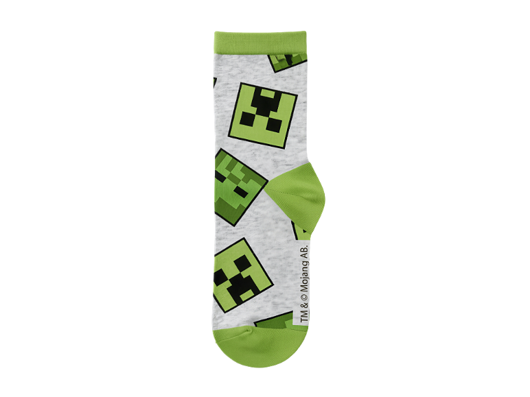 Bela nogavica z vzorcem obrazov Creeper iz igre Minecraft in zelenimi detajli.