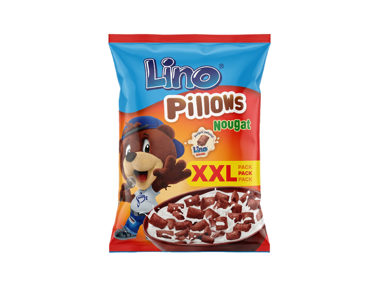 Pakiranje žitaric z medvedkom, skledo žitaric in napisom „Pillows Nougat XXL“.