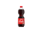Steklenica kola pijače z mehurčki in rdečo etiketo z napisom »Cola«.