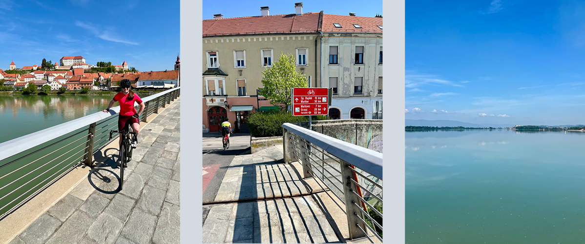 Kolesarji na kolesarski stezi blizu reke in mesta.