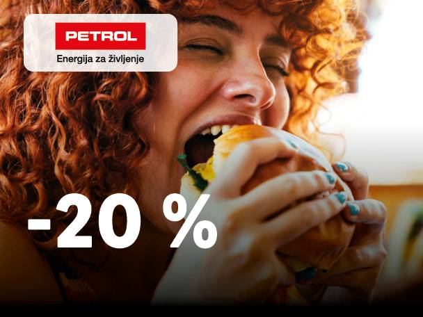 Ženska z rdečimi kodrastimi lasmi grize burger, z 20 % popustom in napisom »Energija za življenje«.