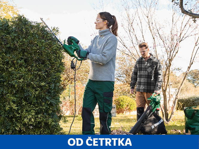 Ženska obrezuje grmovje, moški uporablja puhalnik listja Parkside.