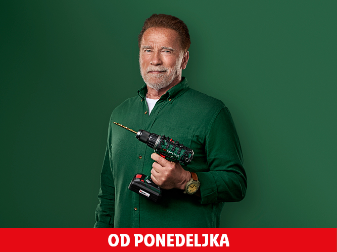 Arnold Schwarzenegger drži zeleno-črni vrtalnik Parkside.