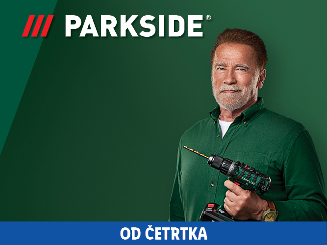 Arnold Schwarzenegger drži Parkside vrtalnik na zeleni podlagi.