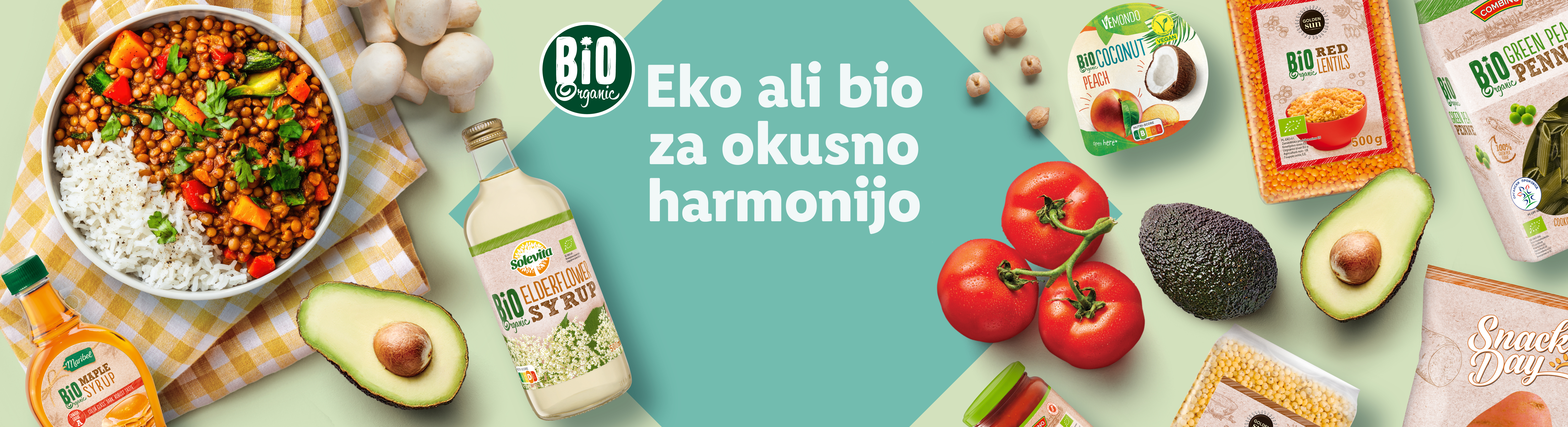 Eko bio hrana: leča, proso, testenine, jogurt in sirupi, predstavljeni v privlačnem aranžmaju.