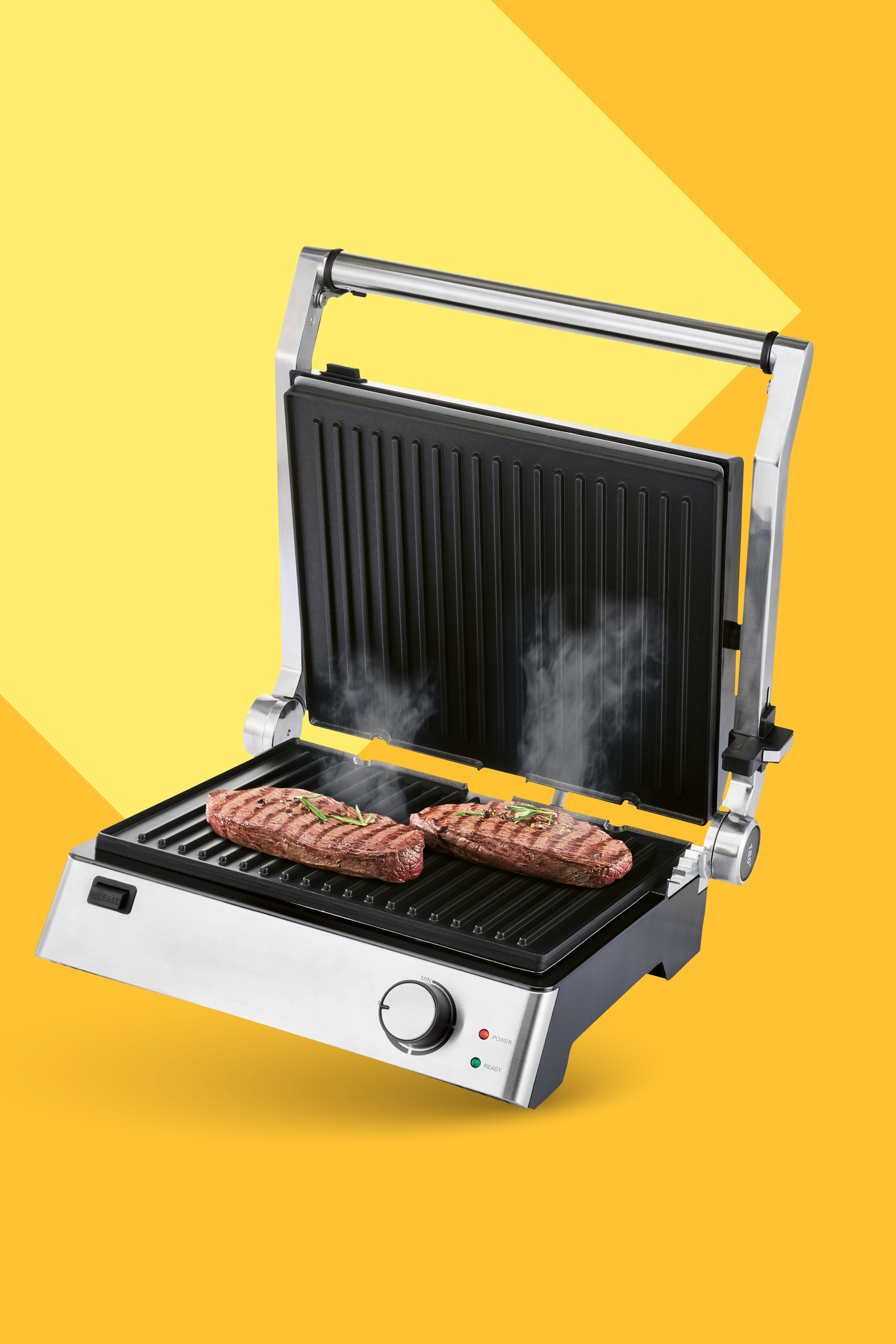 Električni žar z dvema zrezkoma, ki se pečeta in oddajata paro, na rumenem ozadju.